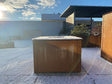 CUBY bålgrill i cortenstål med snø på terrasse