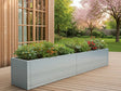 Lang plantekasse i galvanisert stål fra CUBY på treterrasse