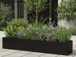 Plantekasse i svart stål med stauder og gress